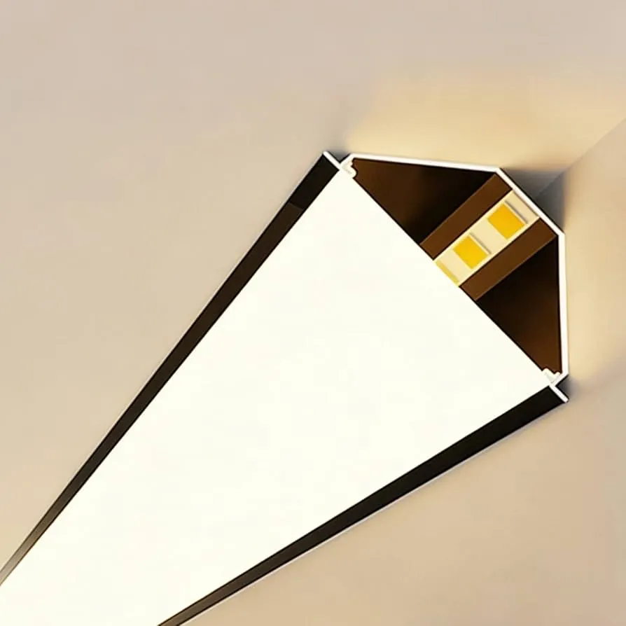 A 45&deg; corner LED diffuser track mounted where the wall meets the ceiling